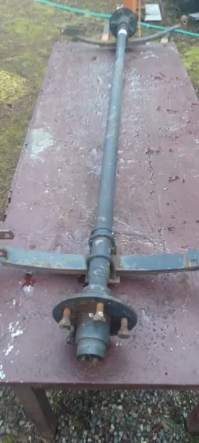 402739 Lippert 2000# Complete Trailer Axle 70 Inch Hub Face 5 Lug Hubs 20.5 Leaf Springs
